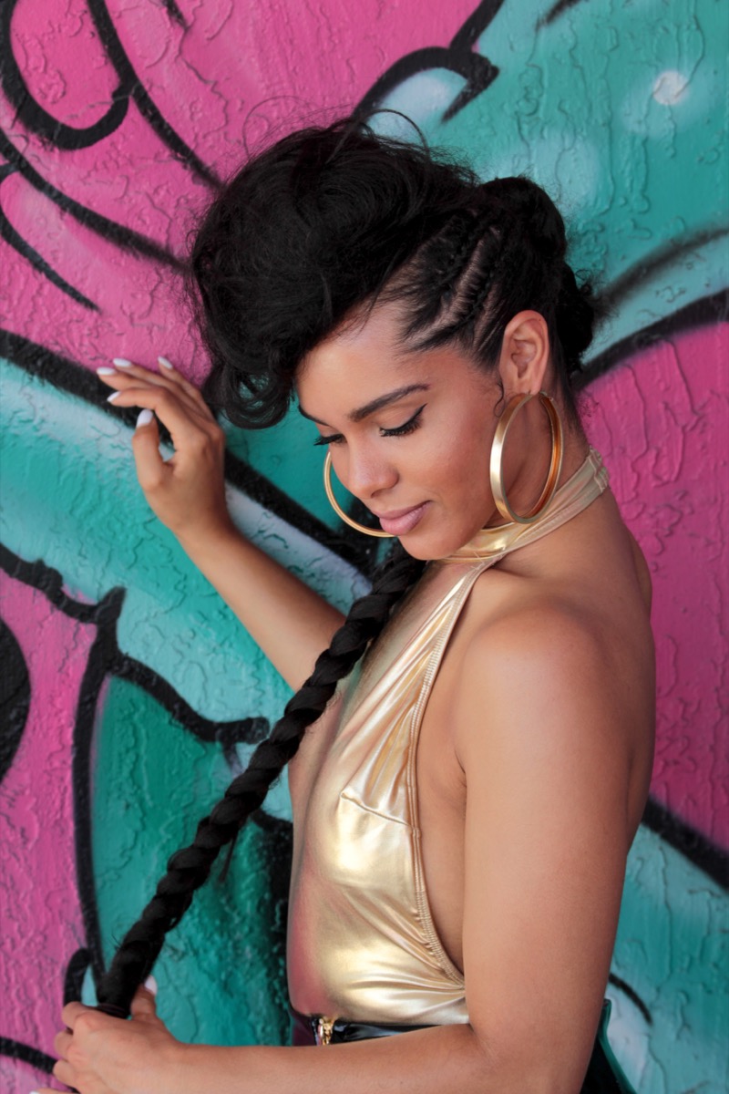 Model wearing long knotless braids from Hair by Alexy in Raleigh, NC